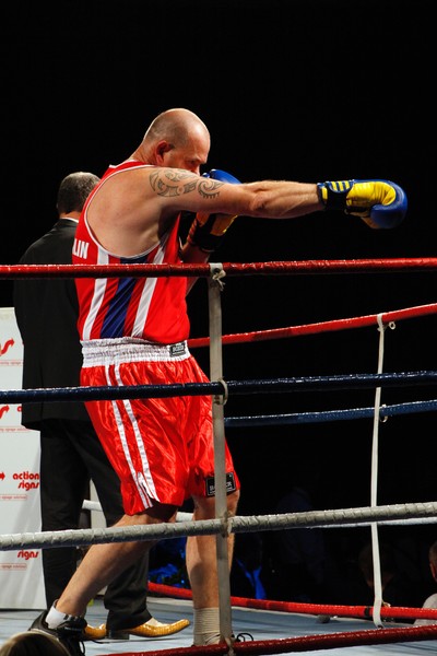 Victorious Bayleys sales consultant Mark O'Loughlin delivers another stinging blow against opponent Ta Karati of Harcourts during the charity fight night. 